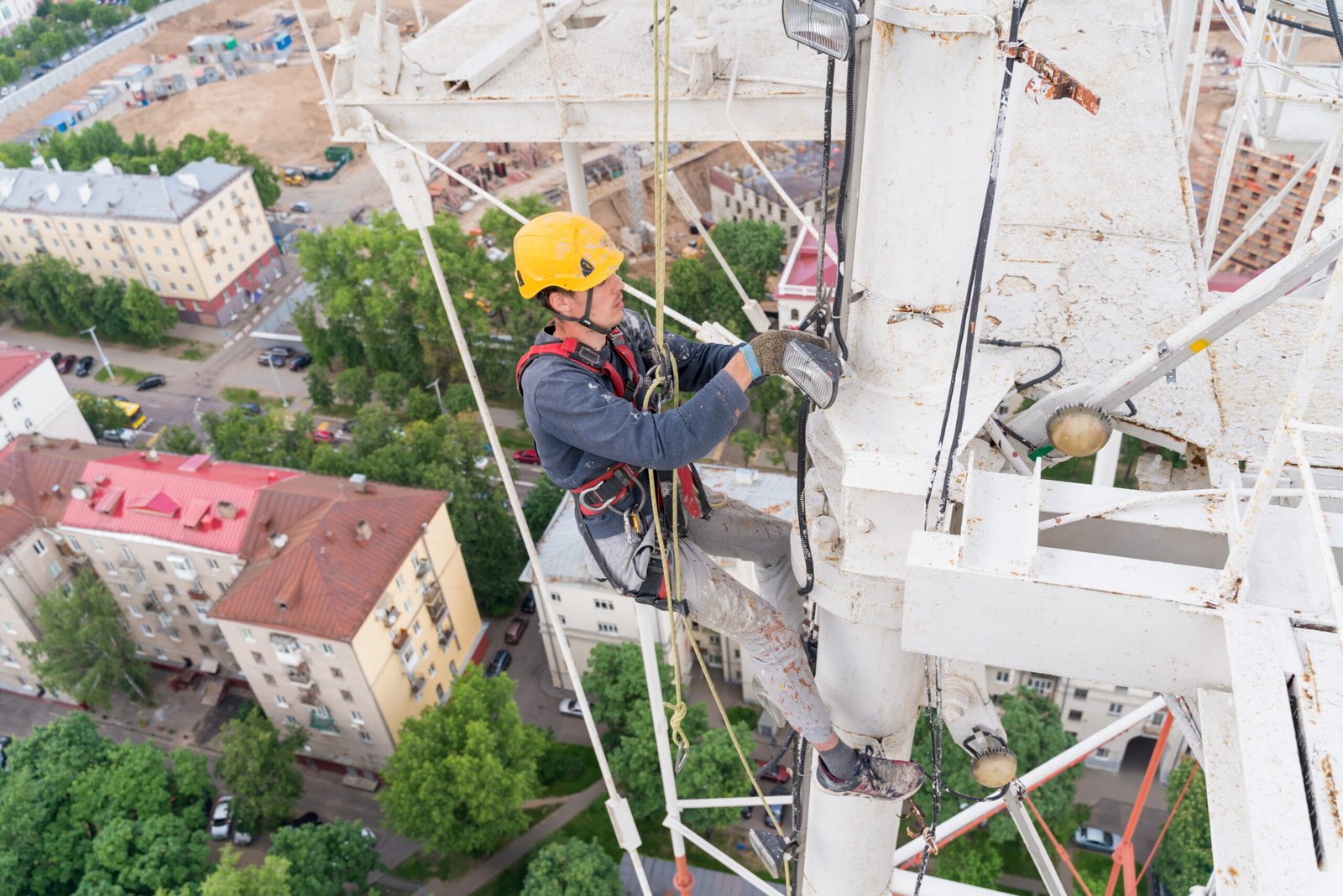 a-worker-with-climbing-equipment-serves-a-city-tv-2023-11-27-05-31-53-utc