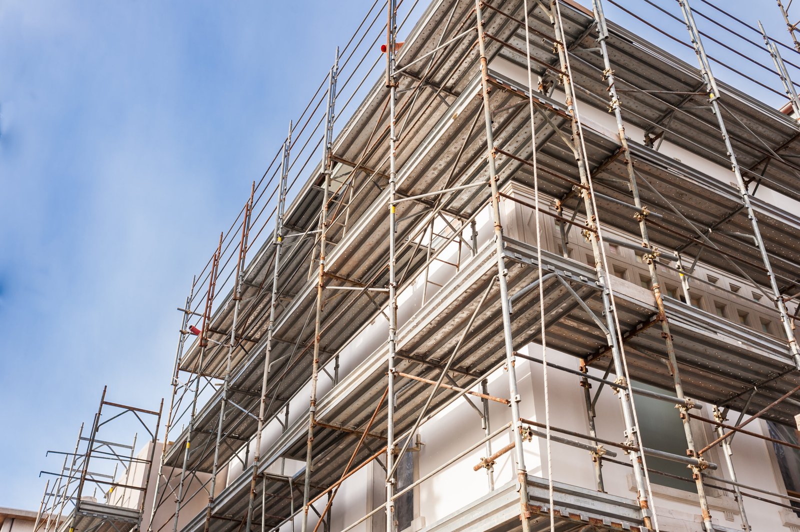 House for renovation with the scaffolding for bricklayers